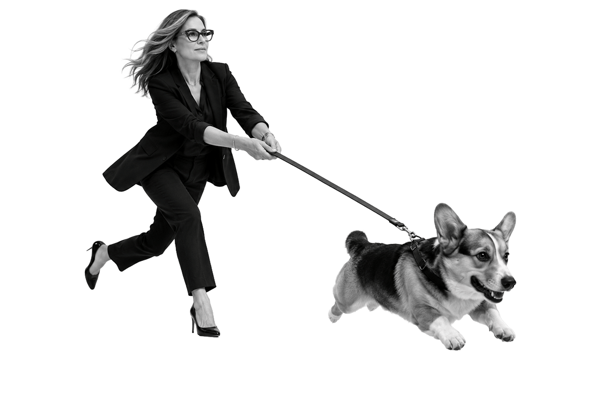woman pulled by corgi